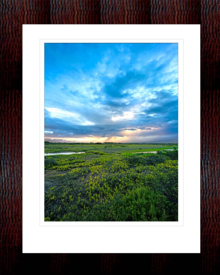 Framed print of Where Land Meets Sky At Sunrise by Fred Gerendasy Photography – fine art photograph of golden light over clouds and land in Maui