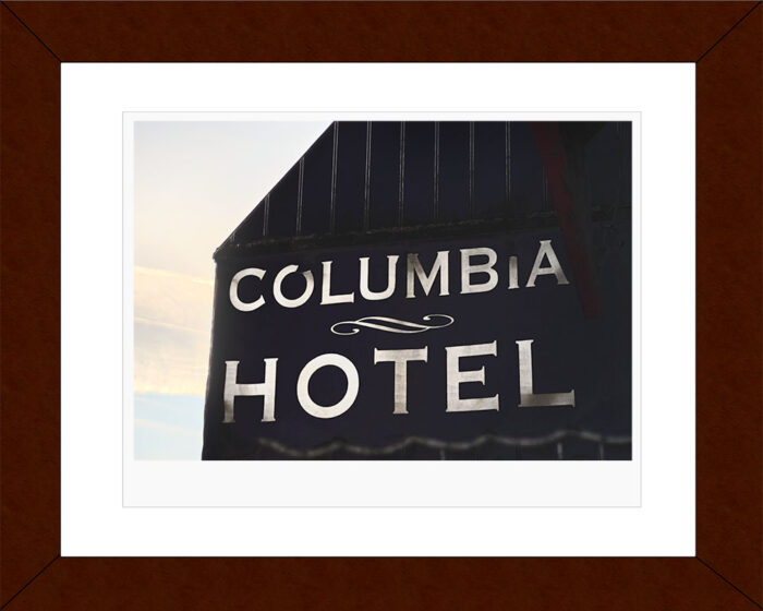 Framed fine art photograph of Columbia Hotel’s architectural sign lit by natural light – Fred Gerendasy Photography