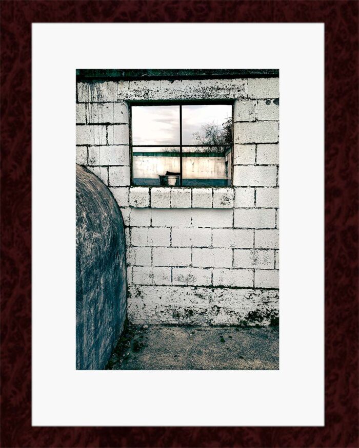 Framed Milking Parlour Remains print by Fred Gerendasy Photography – fine art depiction of decaying dairy barn bathed in natural light, mounted in museum-quality frame