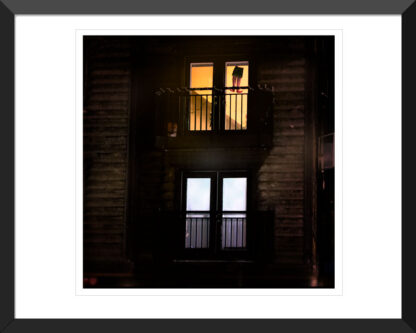 Framed Hanging Man fine art print by Fred Gerendasy Photography – evocative nighttime city scene in archival quality display
