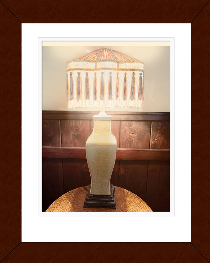 Framed Vintage Table Lamp Transmitting Light print by Fred Gerendasy Photography – fine art photograph of vintage lamp radiating warm light, presented in gallery-quality frame