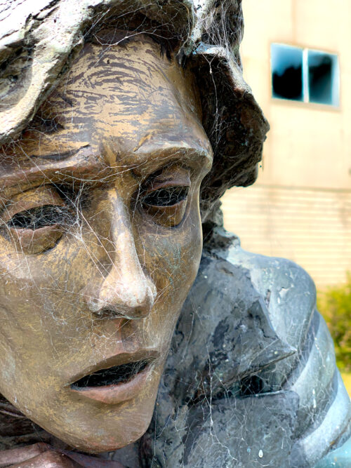 Tsunami Gallery- Sculpture face looking out at doom