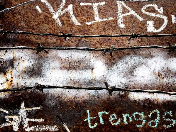 deep brown rusted metal, graffiti and barbed wire in Portland