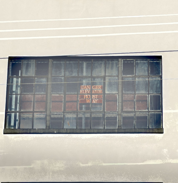 Danger Elevator Hoist Way Sign in paneled window