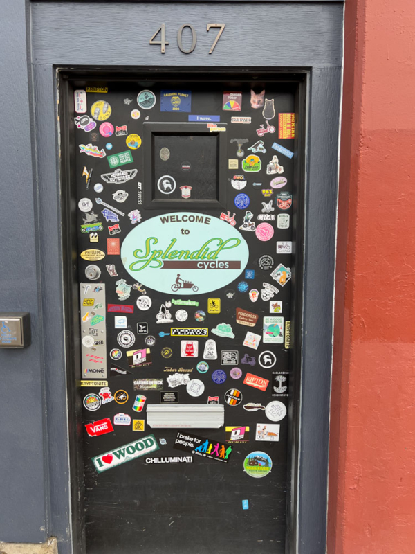 dark door covered in stickers