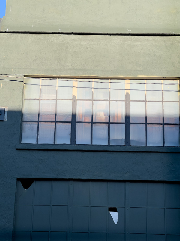 Building in warm light shades of green and blue